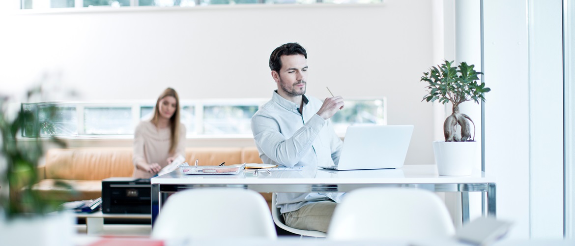 Man sitting at a desk working in an office