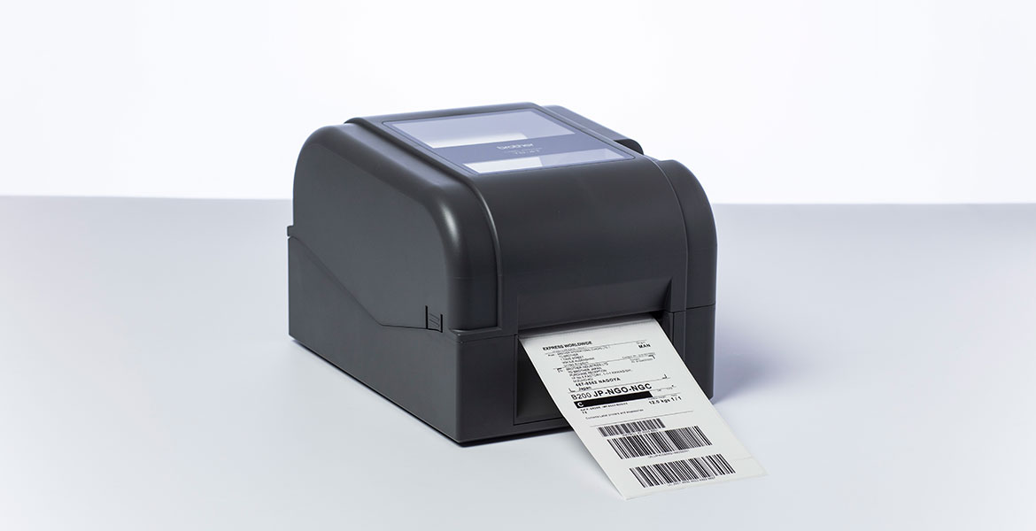 Brother TD-4T desktop label printer printing shipping label in studio
